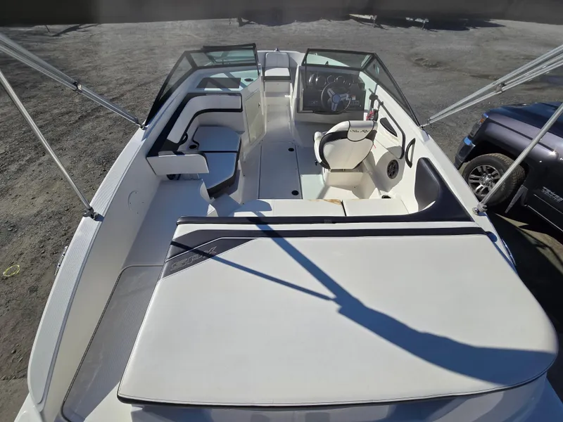 Slide: The Image of 2015 Sea Ray SPX 190 boat interior with seating and steering wheel, viewed from above. - 10