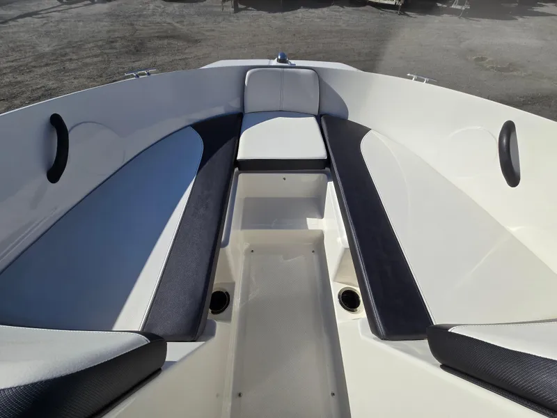 Slide: The Image of 2015 Sea Ray SPX 190 boat interior with cushioned seating and sleek design. - 16