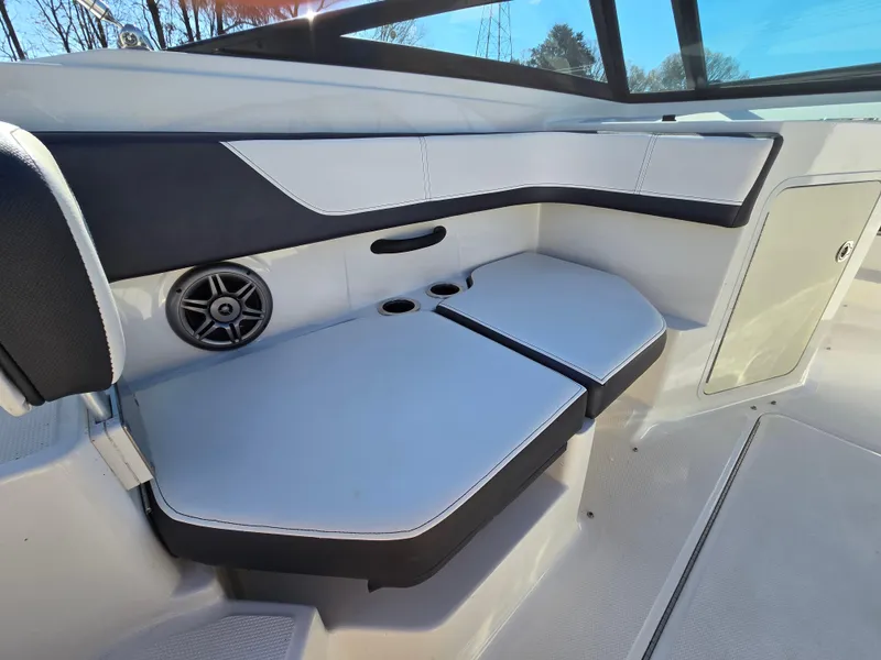 Slide: The Image of 2015 Sea Ray SPX 190 boat interior with cushioned seating and speaker. - 22