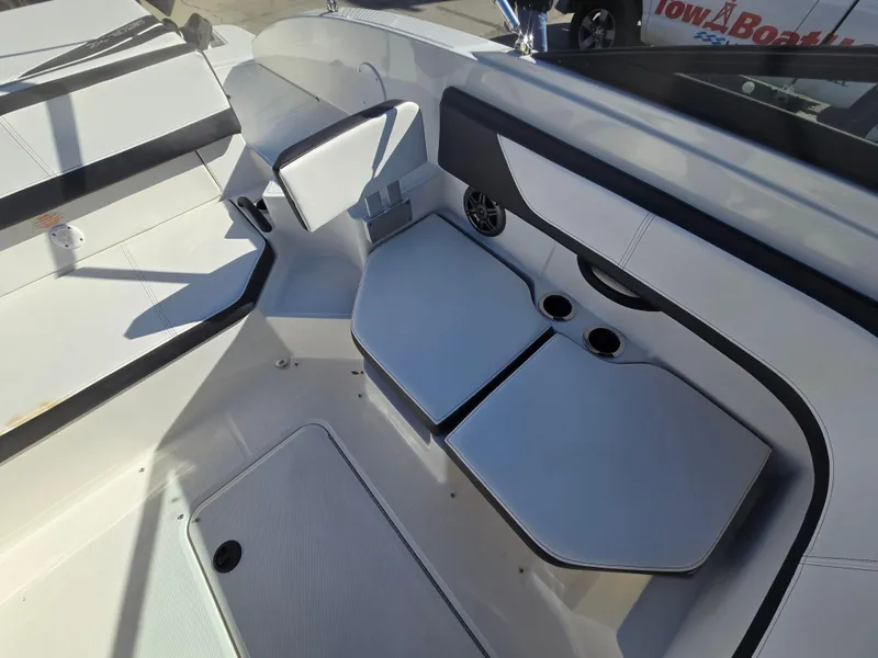 Slide: The Image of 2015 Sea Ray SPX 190 boat interior with white seating and cup holders. - 24