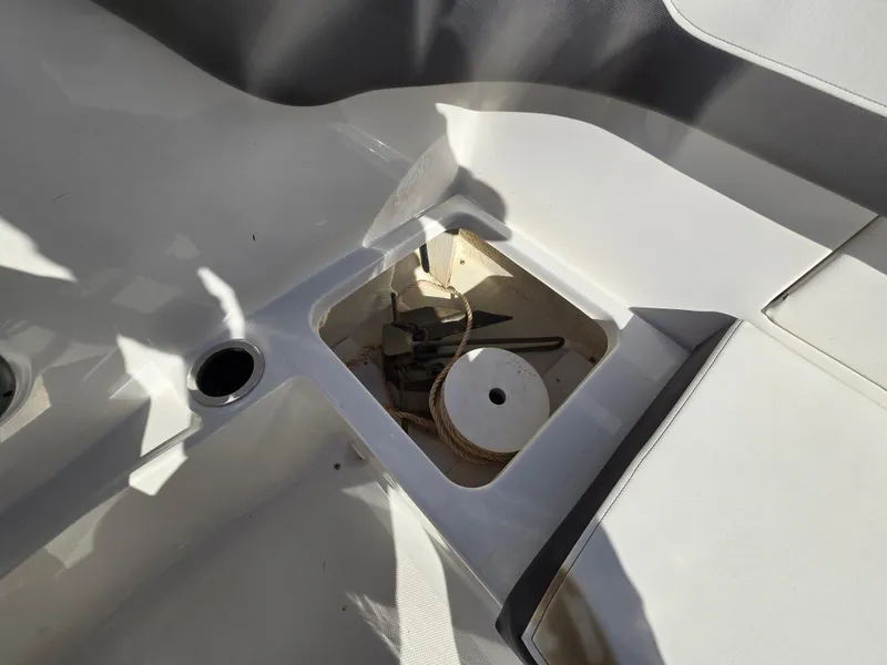 Slide: The Image of 2015 Sea Ray SPX 190 boat interior storage compartment with tools and accessories. - 26