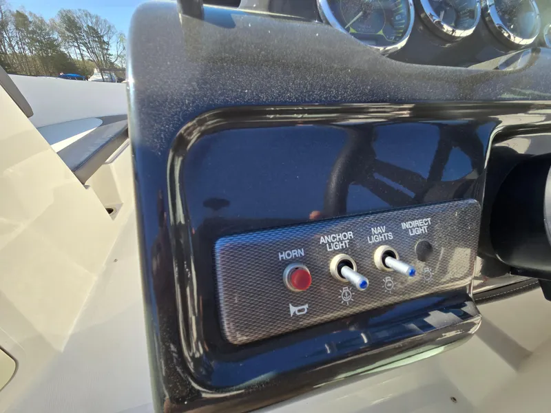 Slide: The Image of Control panel of a 2015 Sea Ray SPX 190 boat with switches and gauges. - 30