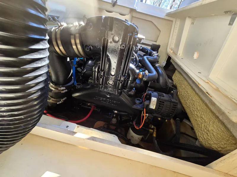 Slide: The Image of Engine compartment of a 2015 Sea Ray SPX 190 boat, showcasing detailed components. - 36