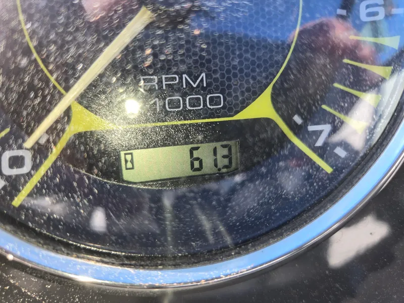 Slide: The Image of Close-up of a Sea Ray SPX 190 2015 tachometer displaying 613 RPM. - 38