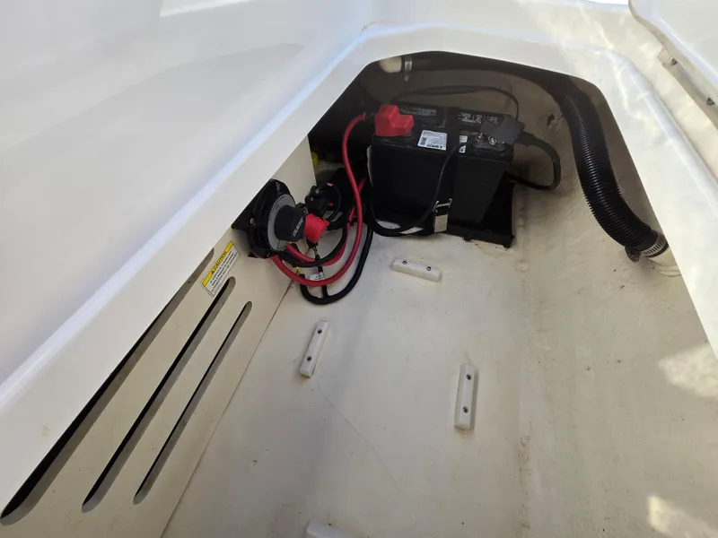 Slide: The Image of Battery compartment of 2015 Sea Ray SPX 190 boat with wiring and connections. - 40