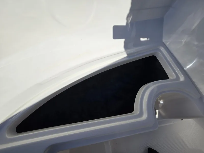 Slide: The Image of 2015 Sea Ray SPX 190 boat interior storage compartment, white and black design. - 42