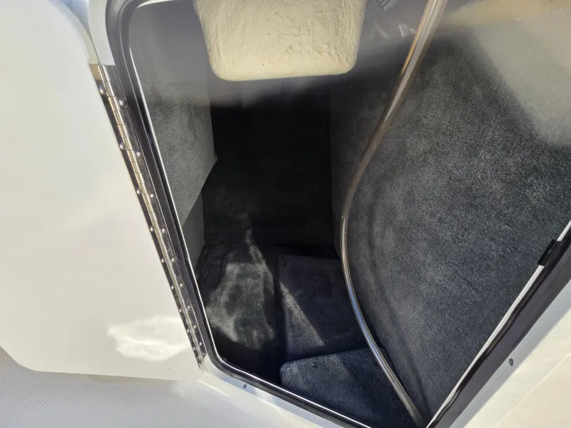 Slide: The Image of Interior storage compartment of a 2015 Sea Ray SPX 190 boat. - 44