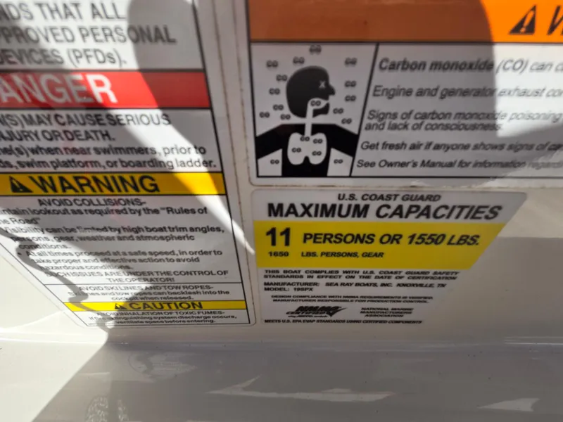 Slide: The Image of 2015 Sea Ray SPX 190 capacity label, max 11 persons or 1550 lbs, safety warnings visible. - 46