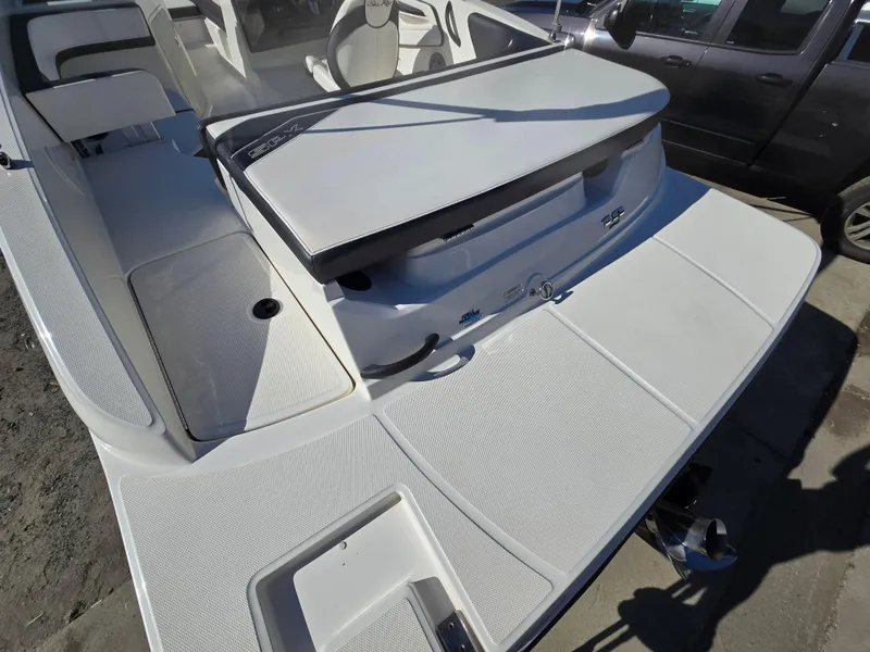 Slide: The Image of 2015 Sea Ray SPX 190 boat with spacious deck and seating area. - 8