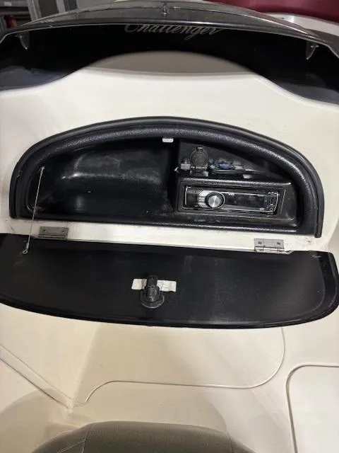 Slide: The Image of 2002 Sea-Doo 180 Challenger dashboard with stereo system and storage compartment. - 15
