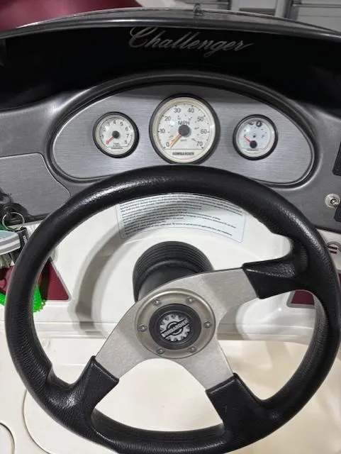 Slide: The Image of Steering wheel and dashboard of 2002 Sea-Doo 180 Challenger boat. - 17