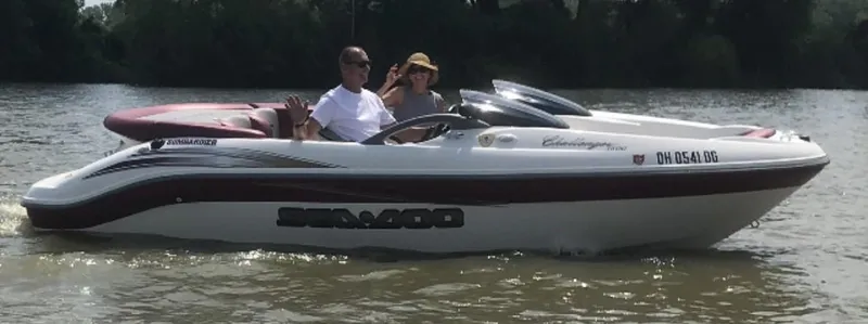 Slide: The Image of 2002 Sea-Doo Sport Boats 180 Challenger on water with two passengers. - 19