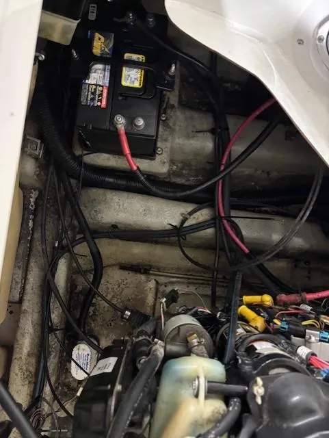Slide: The Image of Engine compartment of a 2002 Sea-Doo Sport Boats 180 Challenger with visible wiring and battery. - 8