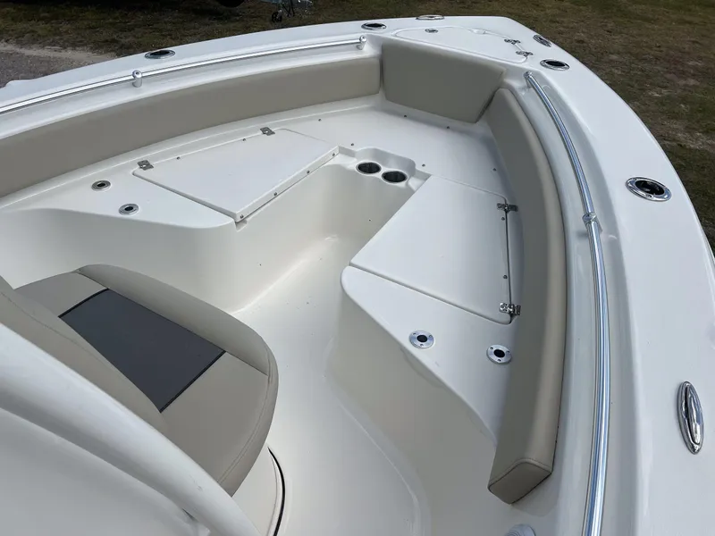 Slide: The Image of 2025 Key West 219 FS boat interior with seating and storage compartments. - 10
