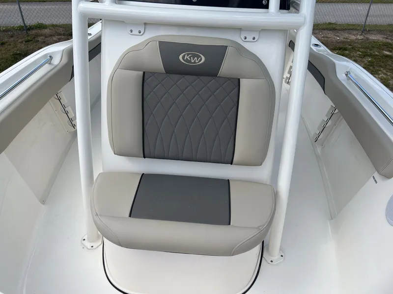 Slide: The Image of 2025 Key West 219 FS boat seat with gray and beige upholstery. - 12
