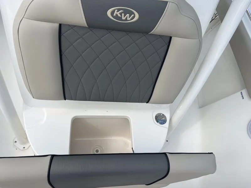 Slide: The Image of 2025 Key West 219 FS boat seat with diamond-patterned upholstery and KW logo. - 13