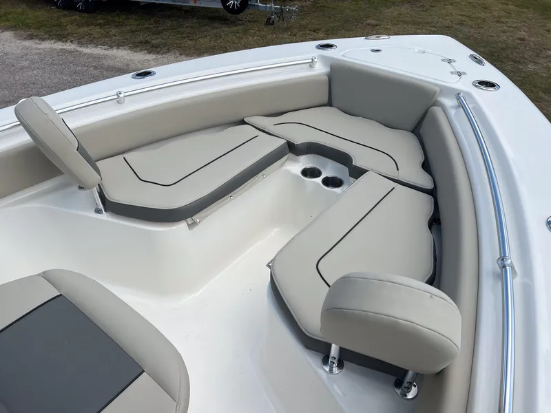 Slide: The Image of 2025 Key West 219 FS boat interior with cushioned seating and cup holders. - 14