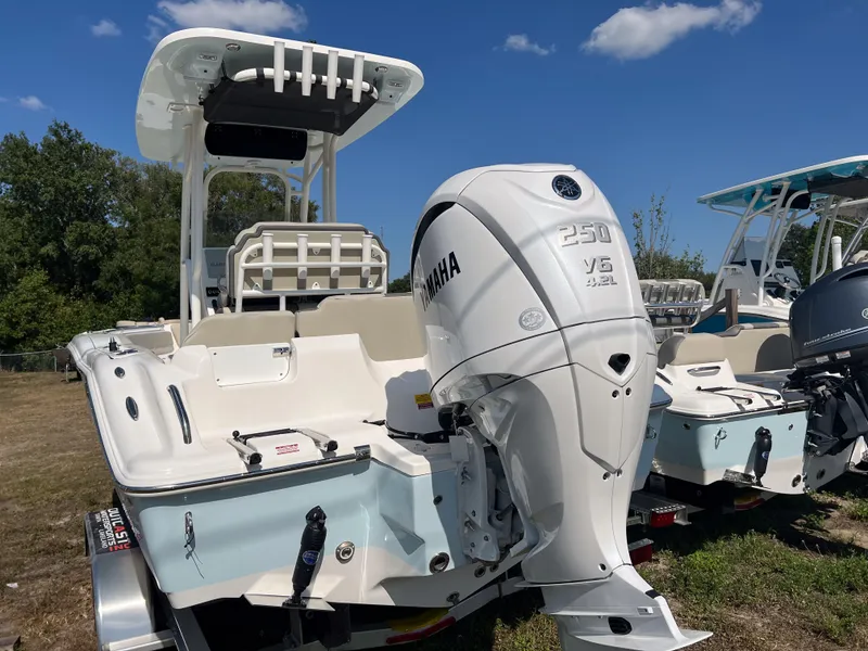 Slide: The Image of 2025 Key West 219 FS boat with Yamaha 250 V6 engine, parked outdoors. - 3