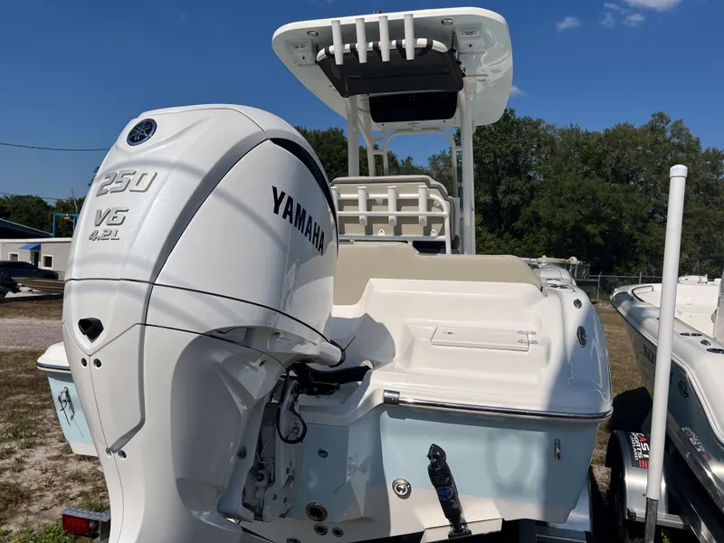 Slide: The Image of 2025 Key West 219 FS boat with Yamaha 250 V6 engine, outdoor display. - 4
