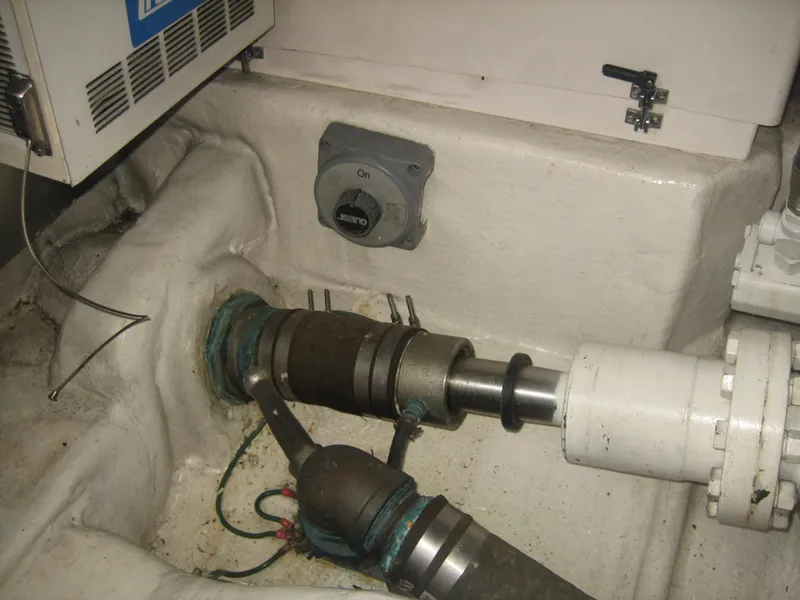 Slide: The Image of Engine room of 2005 Ocean Yachts 50 Super Sport, showing mechanical components and wiring. - 11