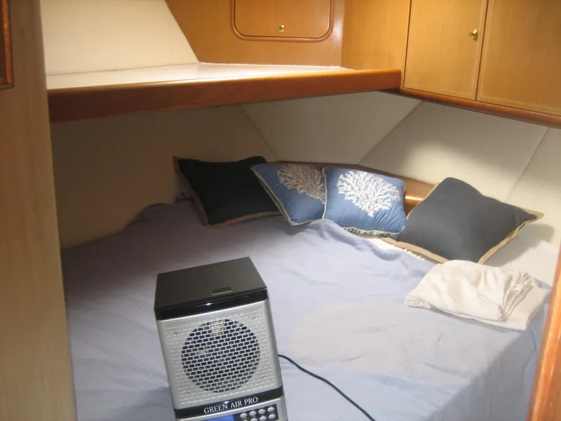 Slide: The Image of Cozy cabin interior of 2005 Ocean Yachts 50 Super Sport with pillows and air purifier. - 9