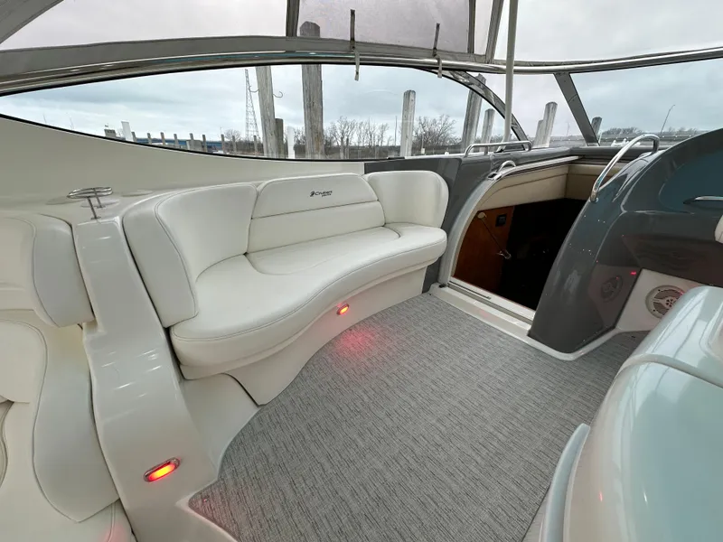 Slide: The Image of 2005 Cruisers Yachts 540 Express interior with white seating and modern design. - 10