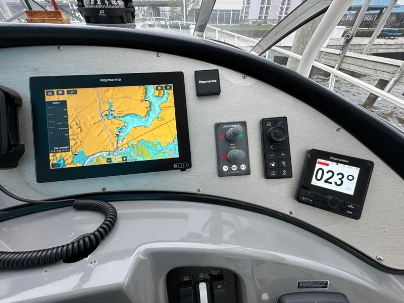 Slide: The Image of 2005 Cruisers Yachts 540 Express dashboard with navigation and control systems. - 14