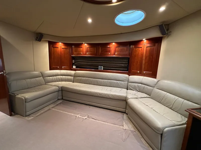 Slide: The Image of Luxurious interior of 2005 Cruisers Yachts 540 Express with leather seating and wood cabinetry. - 22