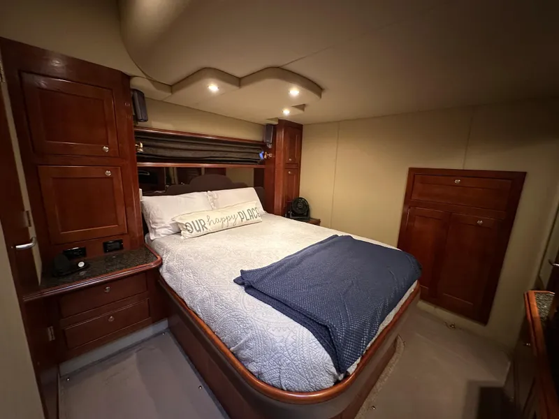 Slide: The Image of Luxurious bedroom interior of 2005 Cruisers Yachts 540 Express with cozy bedding. - 24