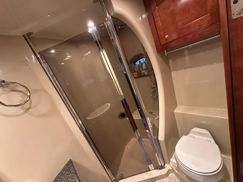 Slide: The Image of Luxurious 2005 Cruisers Yachts 540 Express bathroom with shower and toilet. - 27