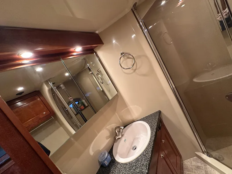Slide: The Image of Luxurious bathroom in 2005 Cruisers Yachts 540 Express with modern fixtures and elegant design. - 28
