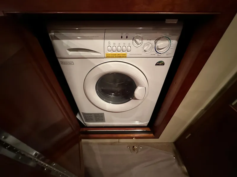 Slide: The Image of Washing machine in 2005 Cruisers Yachts 540 Express, wooden cabinet enclosure. - 35