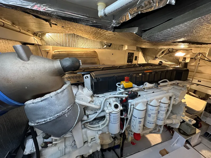 Slide: The Image of Engine room of 2005 Cruisers Yachts 540 Express, showcasing detailed mechanical components. - 38