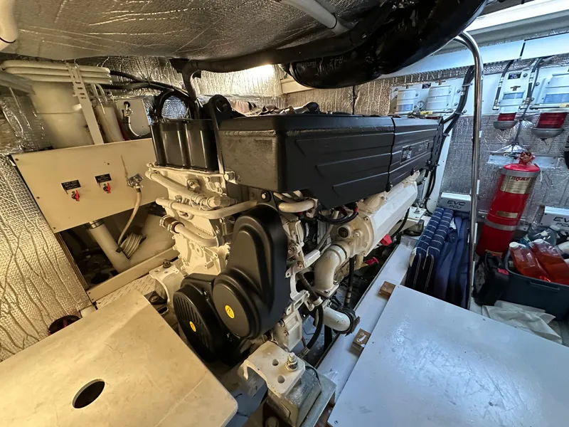 Slide: The Image of Engine room of 2005 Cruisers Yachts 540 Express, showcasing detailed machinery and equipment. - 39