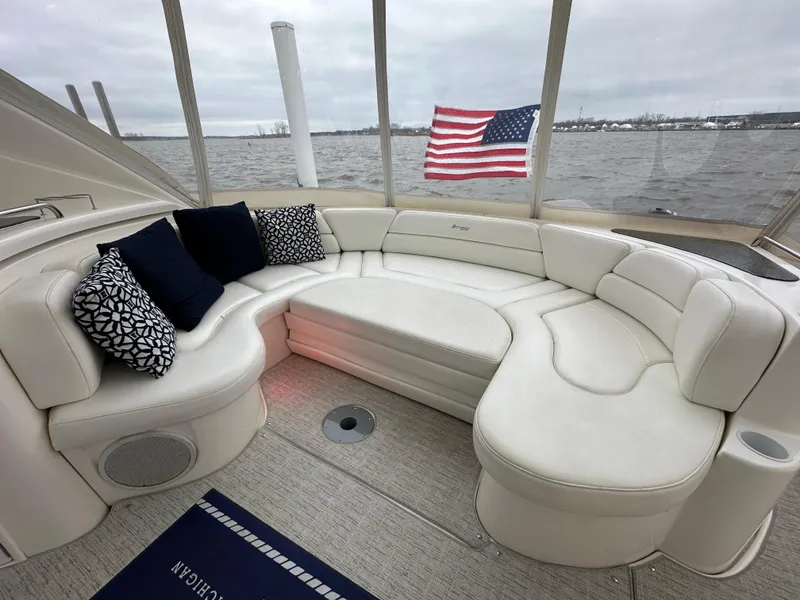 Slide: The Image of Luxurious 2005 Cruisers Yachts 540 Express with elegant seating and American flag in background. - 4