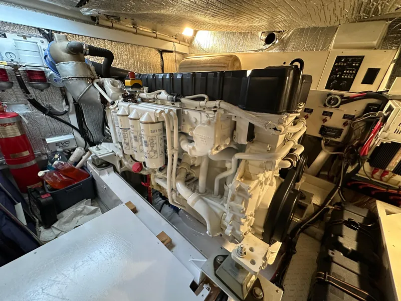 Slide: The Image of Engine room of 2005 Cruisers Yachts 540 Express, featuring a well-maintained marine engine. - 40