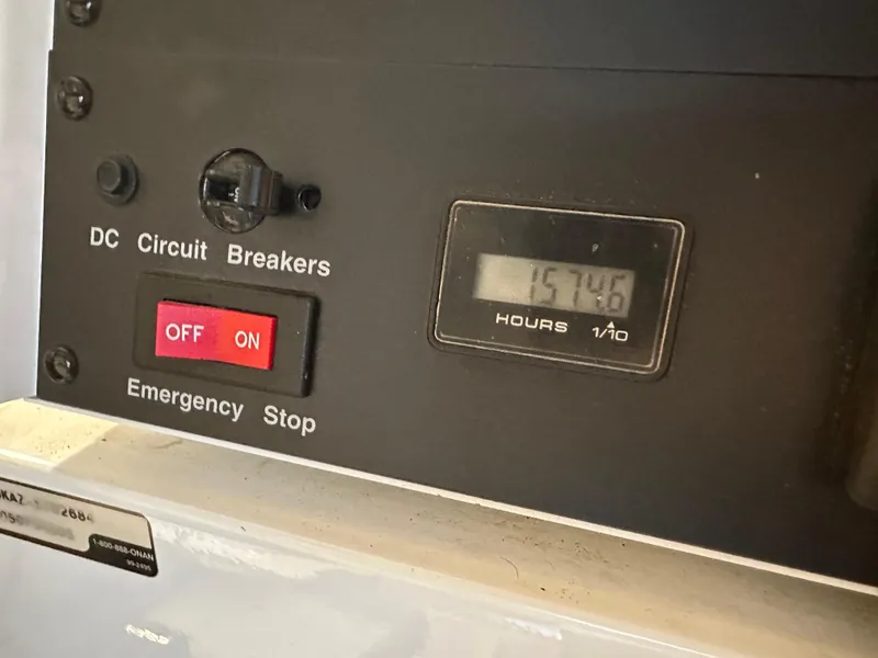 Slide: The Image of Control panel of 2005 Cruisers Yachts 540 Express with circuit breakers and hour meter. - 42