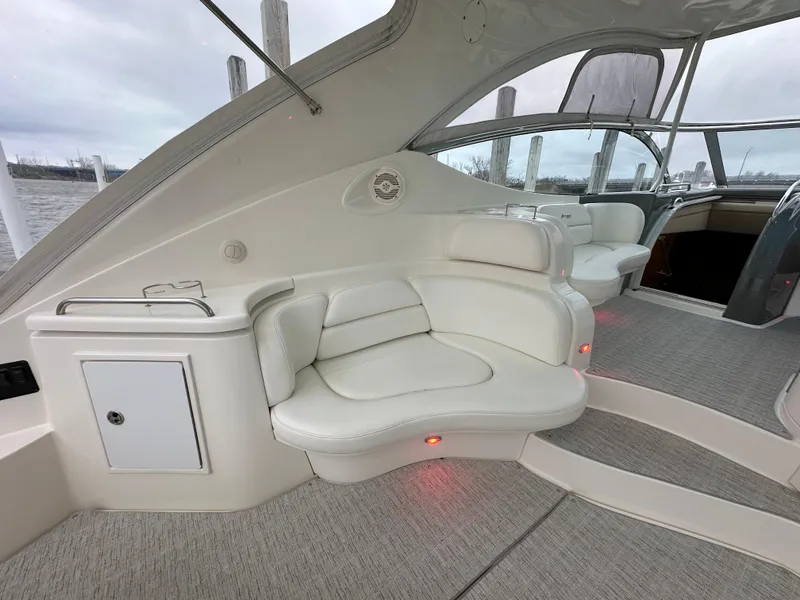 Slide: The Image of 2005 Cruisers Yachts 540 Express interior with plush seating and modern design. - 5