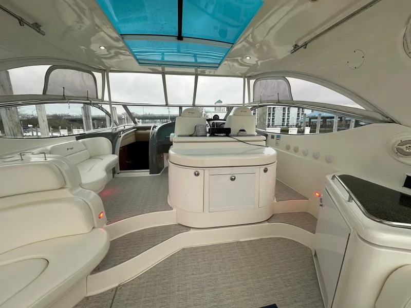 Slide: The Image of Luxurious interior of 2005 Cruisers Yachts 540 Express with spacious seating and modern amenities. - 6