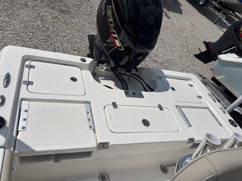 Slide: The Image of 2025 Key West 210 Bay Reef boat with outboard motor, rear deck view. - 10