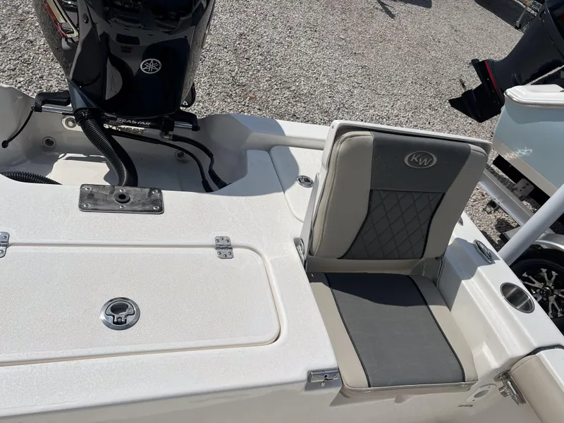 Slide: The Image of 2025 Key West 210 Bay Reef boat with Yamaha engine and cushioned seating. - 12