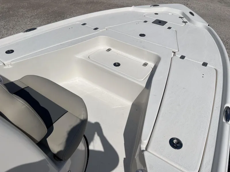 Slide: The Image of 2025 Key West 210 Bay Reef boat deck with storage compartments and seating. - 13