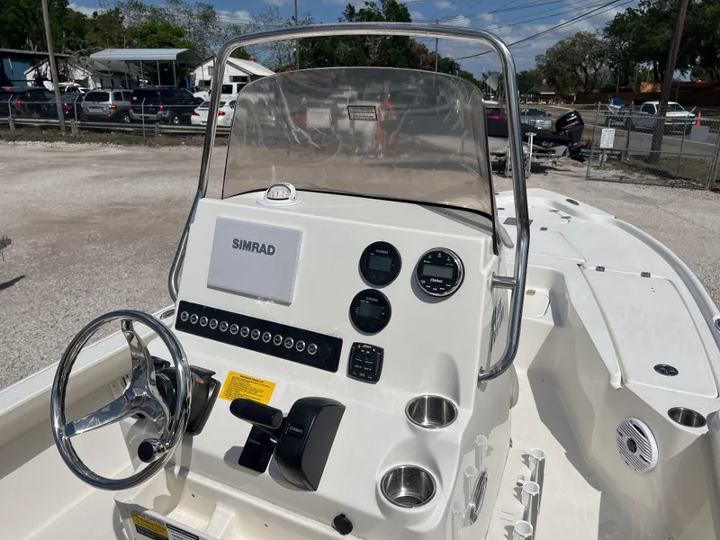 Slide: The Image of 2025 Key West 210 Bay Reef boat console with steering wheel and navigation system. - 8