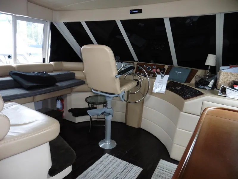 Slide: The Image of 2005 Meridian PILOTHOUSE interior with captain's chair, control panel, and seating area. - 26