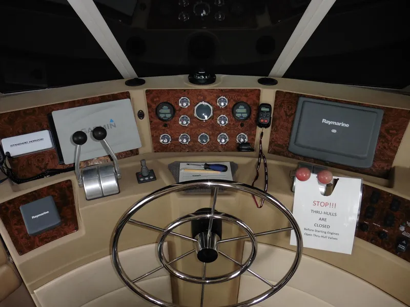 Slide: The Image of 2005 Meridian PILOTHOUSE helm with navigation controls and steering wheel. - 27