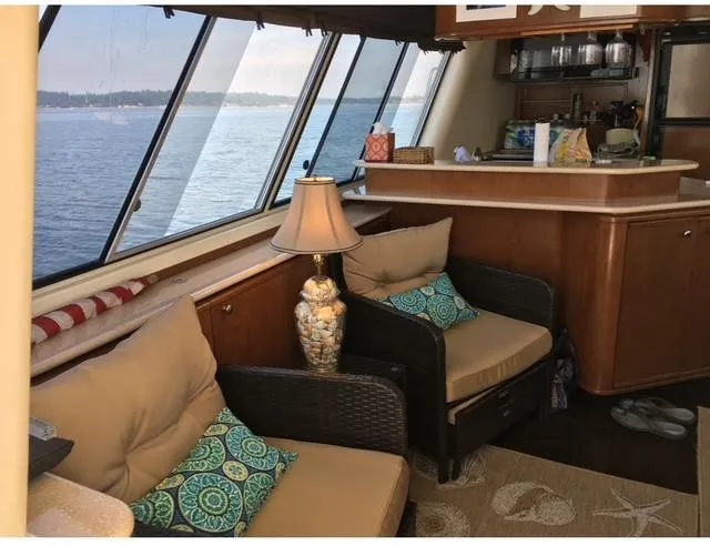 Slide: The Image of Luxurious 2005 Meridian PILOTHOUSE interior with ocean view, cozy seating, and elegant decor. - 3