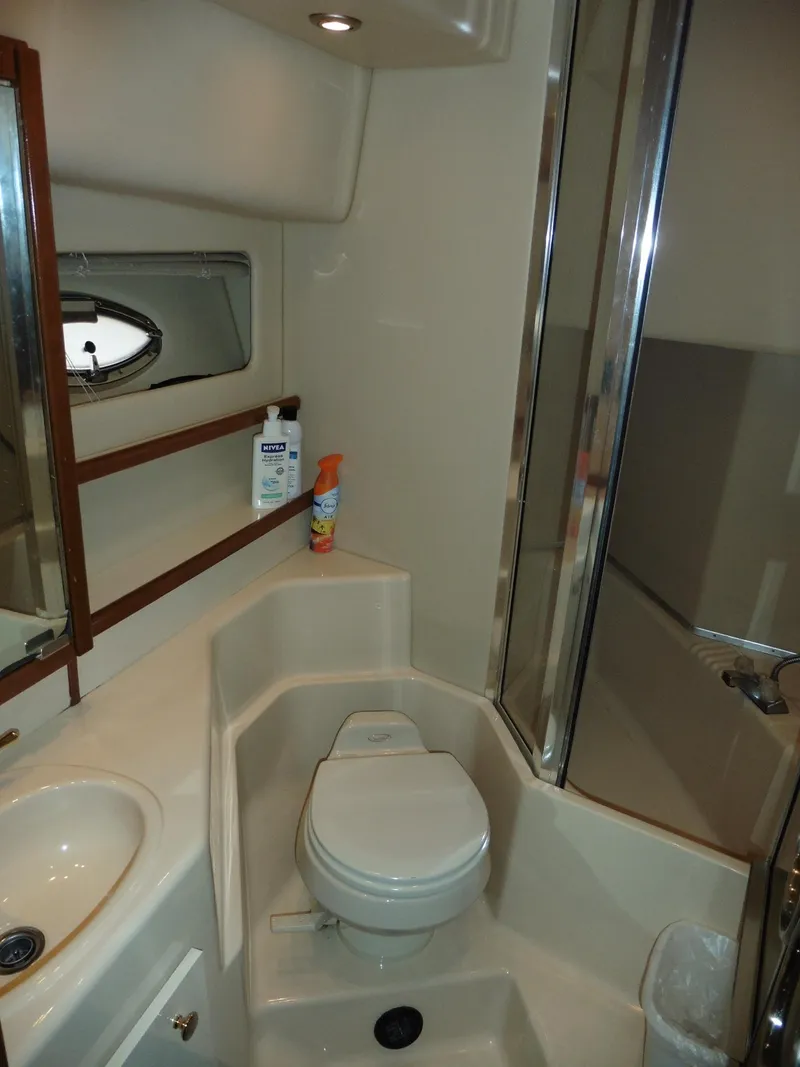 Slide: The Image of 2005 Meridian PILOTHOUSE bathroom with toilet, sink, and shower in compact layout. - 37
