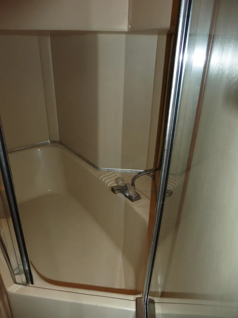 Slide: The Image of Shower area in 2005 Meridian PILOTHOUSE yacht with glass door and chrome fixtures. - 38