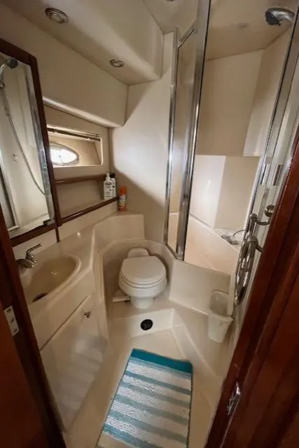 Slide: The Image of Compact bathroom in 2005 Meridian PILOTHOUSE yacht with shower, toilet, and sink. - 6