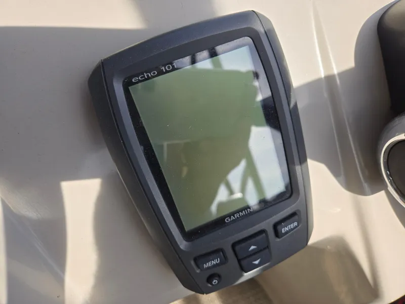 Slide: The Image of Garmin Echo 101 fishfinder on 2015 Bennington 24 SSRX30 boat dashboard. - 21